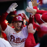 
              Philadelphia Phillies' Rhys Hoskins (17) celebrates after hitting a three-run home run during the third inning in Game 3 of baseball's National League Division Series against the Atlanta Braves, Friday, Oct. 14, 2022, in Philadelphia. (AP Photo/Matt Rourke)
            