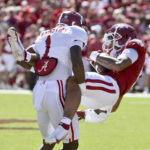 
              Alabama defensive back Kool-Aid McKinstry (1) tackles Arkansas wide receiver Jadon Haselwood (9) during an NCAA college football game Saturday, Oct. 1, 2022, in Fayetteville, Ark. (AP Photo/Michael Woods)
            