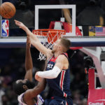 
              Washington Wizards center Kristaps Porzingis, of Latvia, blocks a shot attempt by Philadelphia 76ers guard James Harden in the first half of an NBA basketball game, Monday, Oct. 31, 2022, in Washington. (AP Photo/Patrick Semansky)
            