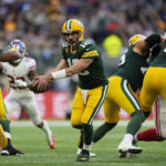 
              Green Bay Packers quarterback Aaron Rodgers (12) scrambles during the second half of an NFL football game against the New York Giants at the Tottenham Hotspur stadium in London, Sunday, Oct. 9, 2022. (AP Photo/Alastair Grant)
            