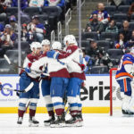 
              Colorado Avalanche players celebrate after a goal by teammate Evan Rodrigues during the second period of an NHL hockey game against the New York Islanders, Saturday, Oct. 29, 2022, in Elmont, N.Y. (AP Photo/Eduardo Munoz Alvarez)
            