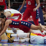 
              United States' Kelsey Plum dives to compete for the ball with China's Li Yueru during their gold medal game at the women's Basketball World Cup in Sydney, Australia, Saturday, Oct. 1, 2022. (AP Photo/Mark Baker)
            
