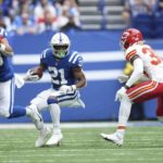 
              Indianapolis Colts running back Nyheim Hines (21) runs against Kansas City Chiefs cornerback L'Jarius Sneed (38) during the first half of an NFL football game, Sunday, Sept. 25, 2022, in Indianapolis. (AP Photo/AJ Mast)
            