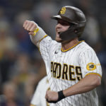 
              San Diego Padres' Wil Myers celebrates after hitting a home run during the eighth inning of a baseball game against the San Francisco Giants, Tuesday, Oct. 4, 2022, in San Diego. (AP Photo/Gregory Bull)
            