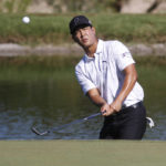 
              Justin Suh hits to the 17th green during the second round of the Shriners Children's Open golf tournament at TPC Summerlin, Friday, Oct. 7, 2022, in Las Vegas. (AP Photo/Ronda Churchill)
            