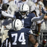 
              Penn State wide receiver KeAndre Lambert-Smith (1) celebrates with offensive lineman Olumuyiwa Fashanu (74) after scoring a touchdown against Ohio State during the first half of an NCAA college football game, Saturday, Oct. 29, 2022, in State College, Pa. (AP Photo/Barry Reeger)
            