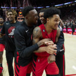 
              Portland Trail Blazers guard Anfernee Simons, front, is congratulated by forward Nassir Little, left, and forward Jabari Walker after the team's NBA basketball game against the Phoenix Sun in Portland, Ore., Friday, Oct. 21, 2022. (AP Photo/Craig Mitchelldyer)
            