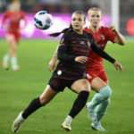 
              Portland Thorns FC forward Sophia Smith, left, looks at the ball next to Kansas City Current defender Hailie Mace (4) during the first half of the NWSL championship soccer match, Saturday, Oct. 29, 2022, in Washington. (AP Photo/Nick Wass)
            