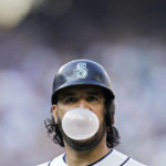 
              Seattle Mariners third baseman Eugenio Suarez (28) blows a bubble after hitting a fly ball for an out against the Houston Astros during the sixth inning in Game 3 of an American League Division Series baseball game Saturday, Oct. 15, 2022, in Seattle. (AP Photo/Abbie Parr)
            