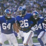 
              New York Giants' Saquon Barkley (26) celebrates with teammate Marcus Johnson (84) and Mark Glowinski (64) after scoring a touchdown during the second half of an NFL football game against the Baltimore Ravens, Sunday, Oct. 16, 2022, in East Rutherford, N.J. (AP Photo/Seth Wenig)
            