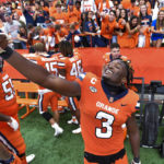 
              FILE - Syracuse linebacker Mikel Jones takes a selfie after a win against Purdue in an NCAA college football game in Syracuse, N.Y., Saturday, Sept. 17, 2022. Syracuse won 32-29. Jones was selected top defensive player in the Associated Press ACC Midseason Awards, Wednesday, Oct. 12, 2022.(AP Photo/Adrian Kraus, File)
            