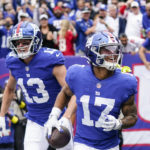 
              New York Giants' David Sills V (13) celebrates with Wan'Dale Robinson (17) after Robinson scored a touchdown during the first half of an NFL football game against the Baltimore Ravens, Sunday, Oct. 16, 2022, in East Rutherford, N.J. (AP Photo/Seth Wenig)
            
