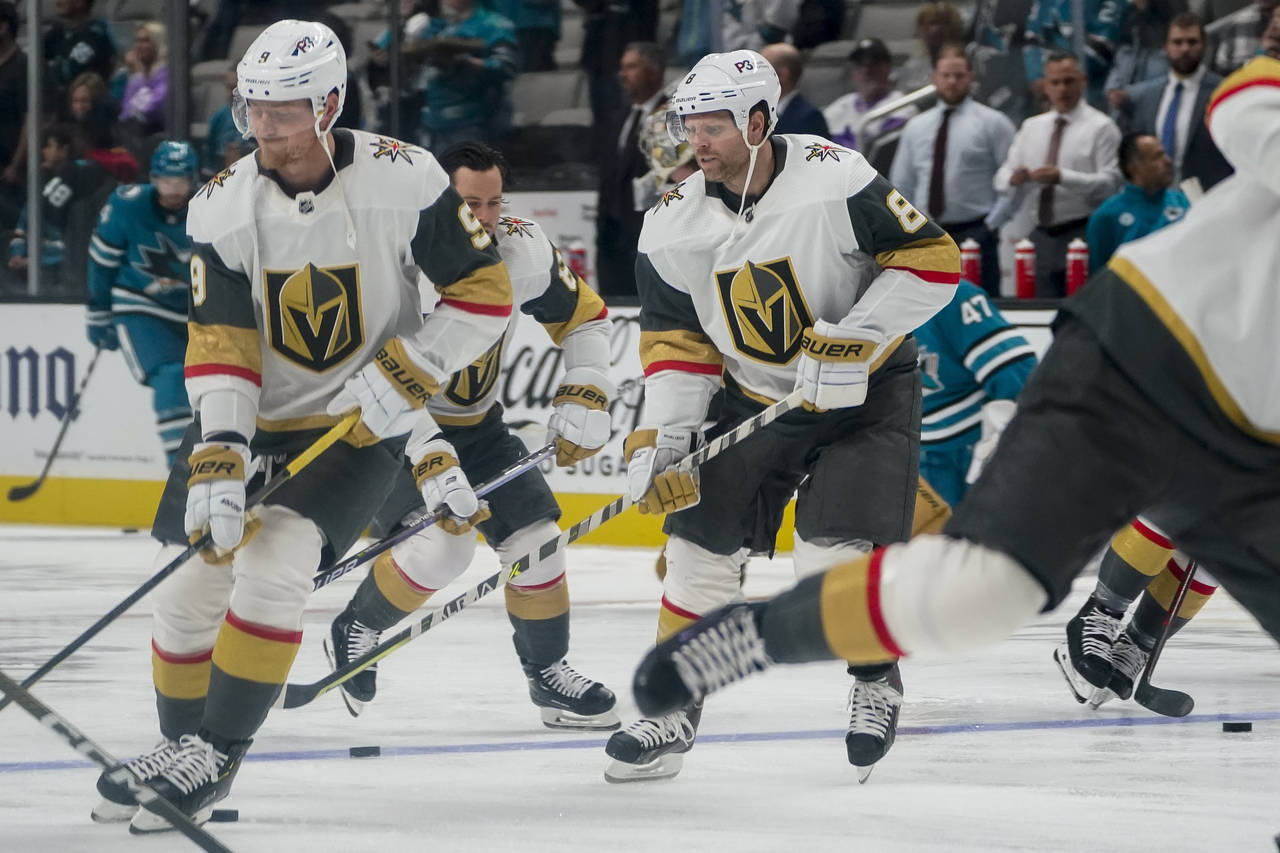 Vegas Golden Knights center Phil Kessel (8) and teammates warm up before an NHL hockey game against...