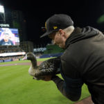 
              San Diego Padres starting pitcher Blake Snell runs with a goose decoy after the Padres defeated the Los Angeles Dodgers 5-3 in Game 4 of a baseball NL Division Series, Saturday, Oct. 15, 2022, in San Diego. (AP Photo/Ashley Landis)
            