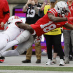 
              Rutgers defensive back Avery Young, left, tackles Ohio State receiver Marvin Harrison during the first half of an NCAA college football game, Saturday, Oct. 1, 2022, in Columbus, Ohio. (AP Photo/Jay LaPrete)
            