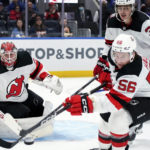
              New Jersey Devils goaltender Mackenzie Blackwood (29) watches as left wing Erik Haula (56) reaches for the puck during the second period of the team's NHL hockey game against the New York Islanders, Thursday, Oct. 20, 2022, in Elmont, N.Y. (AP Photo/Julia Nikhinson)
            