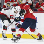 
              Ottawa Senators right wing Drake Batherson (19) and Florida Panthers defenseman Brandon Montour (62) battle for the puck during the first period of an NHL hockey game, Saturday, Oct. 29, 2022, in Sunrise, Fla. (AP Photo/Wilfredo Lee)
            