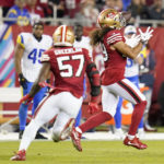 
              San Francisco 49ers safety Talanoa Hufanga, right, returns an interception for a touchdown during the second half of an NFL football game against the Los Angeles Rams in Santa Clara, Calif., Monday, Oct. 3, 2022. (AP Photo/Godofredo A. Vásquez)
            