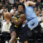 
              Utah Jazz guard Collin Sexton (2) goes to the basket as Memphis Grizzlies guard David Roddy, right, defends during the first half of an NBA basketball game Monday, Oct. 31, 2022, in Salt Lake City. (AP Photo/Rick Bowmer)
            