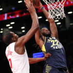 
              Indiana Pacers forward Isaiah Jackson (22) dunks against Brooklyn Nets forward Kevin Durant (7) during the first half of an NBA basketball game, Saturday, Oct. 29, 2022, in New York. (AP Photo/Noah K. Murray)
            