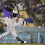 
              Colorado Rockies' Ryan McMahon (24) breaks a bat as he singles during the eighth inning of a baseball game against the Los Angeles Dodgers in Los Angeles, Monday, Oct. 3, 2022. (AP Photo/Ashley Landis)
            