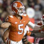 
              Clemson quarterback DJ Uiagalelei looks for a receiver during the first half of the team's NCAA college football game against Boston College, Saturday, Oct. 8, 2022, in Boston. (AP Photo/Mark Stockwell)
            