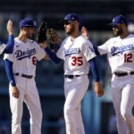 
              Los Angeles Dodgers' Gavin Lux (9), Trea Turner (6), Cody Bellinger (35) and Joey Gallo (12) celebrate the team's 6-1 win over the Colorado Rockies in a baseball game Wednesday, Oct. 5, 2022, in Los Angeles. (AP Photo/Marcio Jose Sanchez)
            
