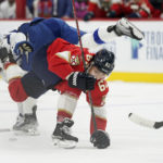 
              Florida Panthers defenseman Brandon Montour (62) and Tampa Bay Lightning left wing Brandon Hagel collide during the first period of an NHL hockey game, Friday, Oct. 21, 2022, in Sunrise, Fla. (AP Photo/Wilfredo Lee )
            