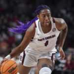 
              FILE - South Carolina forward Aliyah Boston dribbles the ball during the first half of the team's NCAA college basketball game against Stanford on Tuesday, Dec. 21, 2021, in Columbia, S.C. Boston is a unanimous choice to the women's Associated Press preseason All-America team, Tuesday, Oct. 25, 2022. (AP Photo/Sean Rayford, File)
            