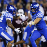 
              Kentucky quarterback Will Levis, right, hands the ball off to Kentucky running back Chris Rodriguez Jr. during the first half of an NCAA college football game against Mississippi State in Lexington, Ky., Saturday, Oct. 15, 2022. (AP Photo/Michael Clubb)
            