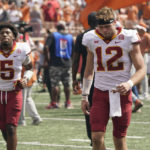 
              Iowa State quarterback Hunter Dekkers (12) and defensive back Myles Purchase (5) walk off the field following their loss to Texas in an NCAA college football game, Saturday, Oct. 15, 2022, in Austin, Texas. (AP Photo/Eric Gay)
            