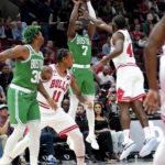 
              Boston Celtics' Jaylen Brown (7) shoots as Chicago Bulls' Patrick Williams (44) defends during the first half of an NBA basketball game Monday, Oct. 24, 2022, in Chicago. (AP Photo/Charles Rex Arbogast)
            