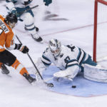 
              San Jose Sharks goaltender James Reimer (47) blocks a shot from Philadelphia Flyers right wing Travis Konecny (11) during the second period of an NHL hockey game, Sunday, Oct. 23, 2022, in Philadelphia. (AP Photo/Laurence Kesterson)
            