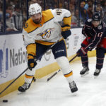 
              Nashville Predators defenseman Alexandre Carrier, left, controls the puck in front of Columbus Blue Jackets forward Johnny Gaudreau during the second period of an NHL hockey game in Columbus, Ohio, Thursday, Oct. 20, 2022. (AP Photo/Paul Vernon)
            