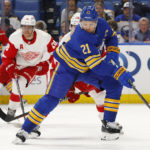 
              Buffalo Sabres right wing Kyle Okposo (21) is chased by Detroit Red Wings center Andrew Copp (18) during the first period of an NHL hockey game, Monday, Oct. 31, 2022, in Buffalo, N.Y. (AP Photo/Jeffrey T. Barnes)
            