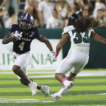 
              Nevada wide receiver BJ Casteel (4) runs past Hawaii defensive back Peter Manuma (33) during the first half of an NCAA college football game on Saturday, Oct. 15, 2022, in Honolulu. (AP Photo/Marco Garcia)
            