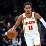 
              Atlanta Hawks guard Trae Young brings the ball up against the Orlando Magic during the first half of an NBA basketball game Friday, Oct. 21, 2022, in Atlanta. (AP Photo/Butch Dill)
            