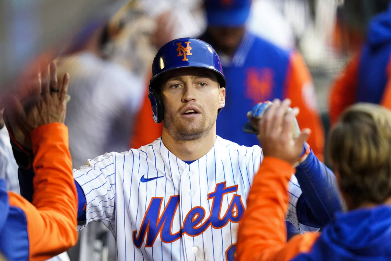 New York Mets' Brandon Nimmo celebrates with teammates after hitting a home run during the fourth i...