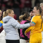 
              England head coach Sarina Wiegman, second left, celebrates with England's goalkeeper Mary Earps after the women's friendly soccer match between England and the US at Wembley stadium in London, Friday, Oct. 7, 2022. (AP Photo/Kirsty Wigglesworth)
            