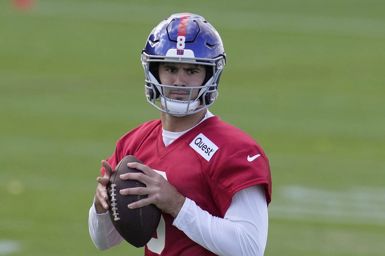 New York Giants quarterback Daniel Jones, number 8, attends a practice session at Hanbury Manor in ...