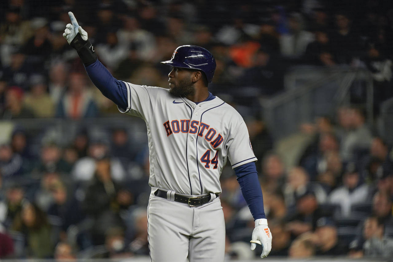 Houston Astros Yordan Alvarez (44) reacts after scoring against the New York Yankees during the thi...