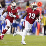
              San Francisco 49ers wide receiver Deebo Samuel (19) runs toward the end zone to score against the Los Angeles Rams during the first half of an NFL football game in Santa Clara, Calif., Monday, Oct. 3, 2022. (AP Photo/Godofredo A. Vásquez)
            