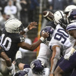 
              Penn State running back Nicholas Singleton (10) fumbles the ball against Northwestern during the first half of an NCAA college football game, Saturday, Oct. 1, 2022, in State College, Pa. (AP Photo/Barry Reeger)
            