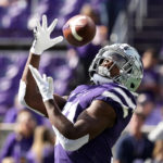 
              Kansas State running back DJ Giddens catches a pass during warmups before an NCAA college football game against Oklahoma State Saturday, Oct. 29, 2022, in Manhattan, Kan. (AP Photo/Charlie Riedel)
            