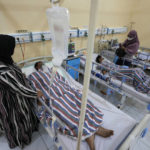 
              Relatives stand nearby as survivors of Saturday's deadly crush are treated at a hospital in Malang, East Java, Indonesia, Monday Oct. 3, 2022. Police firing tear gas at Saturday night's match between host Arema FC of East Java's Malang city and Persebaya Surabaya in an attempt to stop violence triggered a disastrous crush of fans making a panicked, chaotic run for the exits, leaving a large number of people dead, most of them trampled upon or suffocated. (AP Photo/Achmad Ibrahim)
            