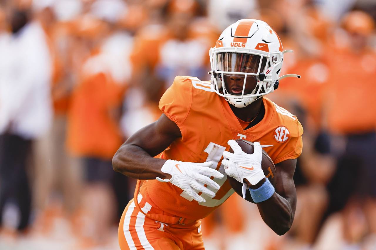 Tennessee wide receiver Squirrel White (10) runs for a touchdown after catching a pass during the s...