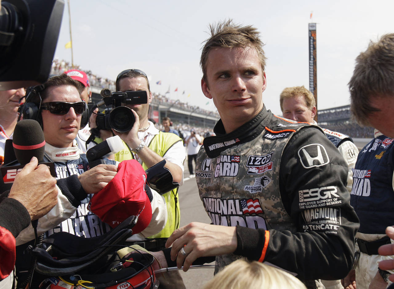 FILE - Dan Wheldon, of England, speaks with reporters after finishing in second place in the Indian...
