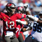 
              Tampa Bay Buccaneers quarterback Tom Brady (12) looks to pass as Carolina Panthers defensive tackle Derrick Brown (95) closes in during the second half of an NFL football game Sunday, Oct. 23, 2022, in Charlotte, N.C. (AP Photo/Jacob Kupferman)
            