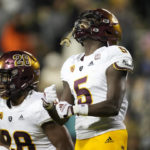 
              Arizona State defensive back Chris Edmonds, celebrates his pass interception with linebacker Will Shaffer in the second half of an NCAA college football game against Colorado, Saturday, Oct. 29, 2022, in Boulder, Colo. (AP Photo/David Zalubowski)
            