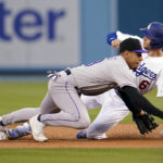 
              Los Angeles Dodgers' Trea Turner (6) steals second base next to Colorado Rockies second baseman Alan Trejo during the first inning of a baseball game Saturday, Oct. 1, 2022, in Los Angeles. (AP Photo/Marcio Jose Sanchez)
            